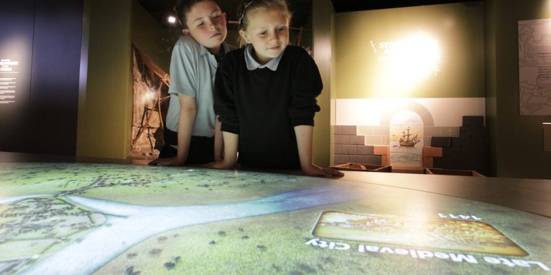 Schoolkids-absorbed-in-table-map